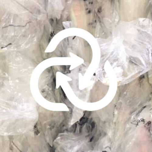 Up close clear scrap bale with closed loop recycling logo