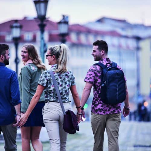 Craghoppers people walking holding hands in a city