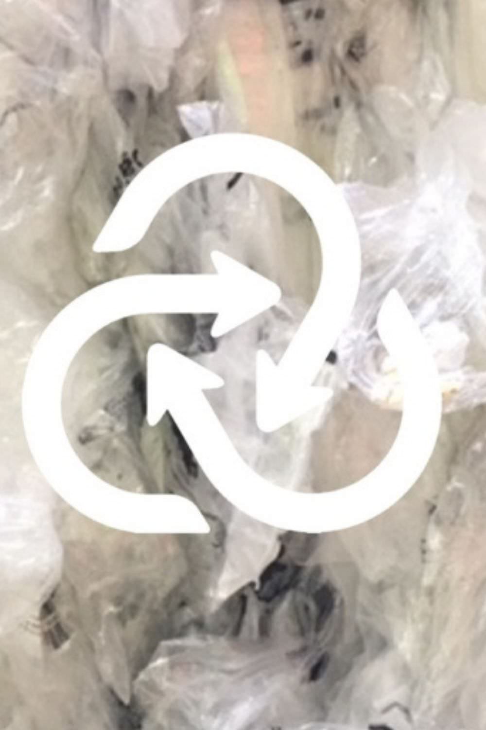 Closed Loop recycling logo on top of clear scrap
