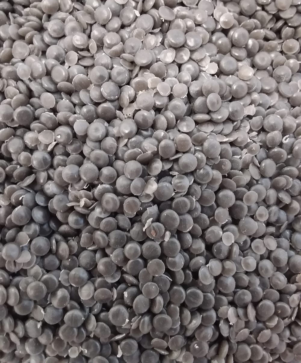 Up close image of pellets used to produce recycled mailing bags.