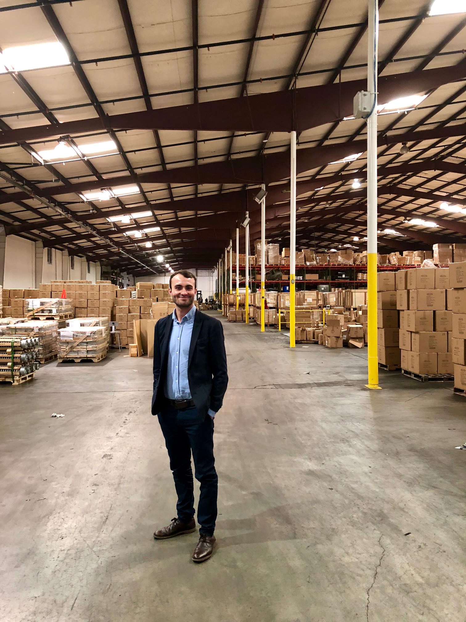 Tom standing in Duo's first stock warehouse in Atlanta