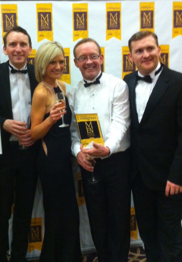 Directors at the Manchester Evening News Awards with winning trophy