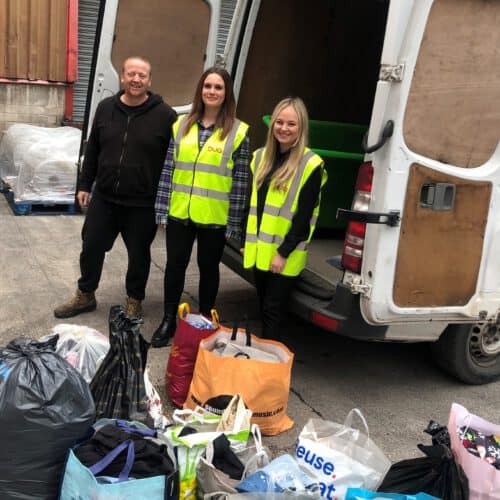 Nikita and Georgia with bags of clothes